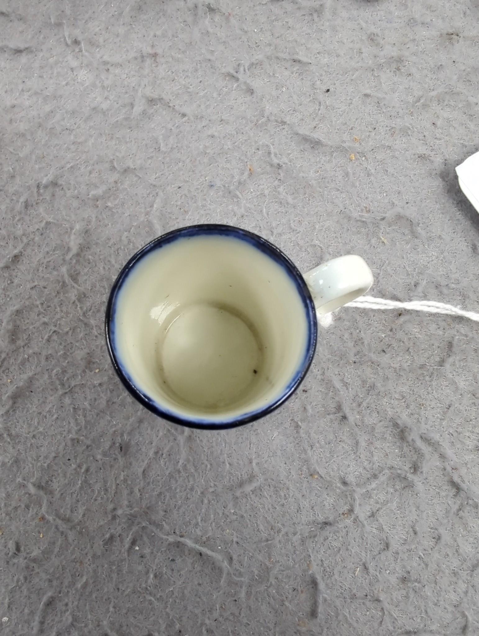 A late 18th century pearlware blue and white miniature jug, 5cm, and tea bowl and an English porcelain miniature mug, late 18th century